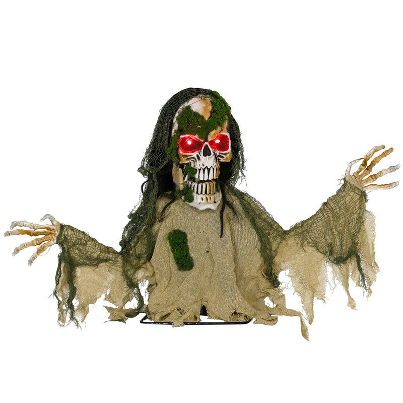 Half-body skeleton Halloween prop with moss-covered skull, red glowing eyes and khaki tattered robe on a ground stand