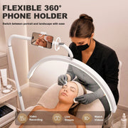 White floor lamp phone holder rotating 360 degrees during a facial treatment