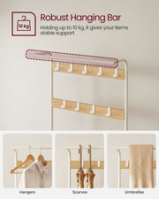 Close-up of the hanging bar with a 10 kg load label, holding hangers, scarves and umbrellas