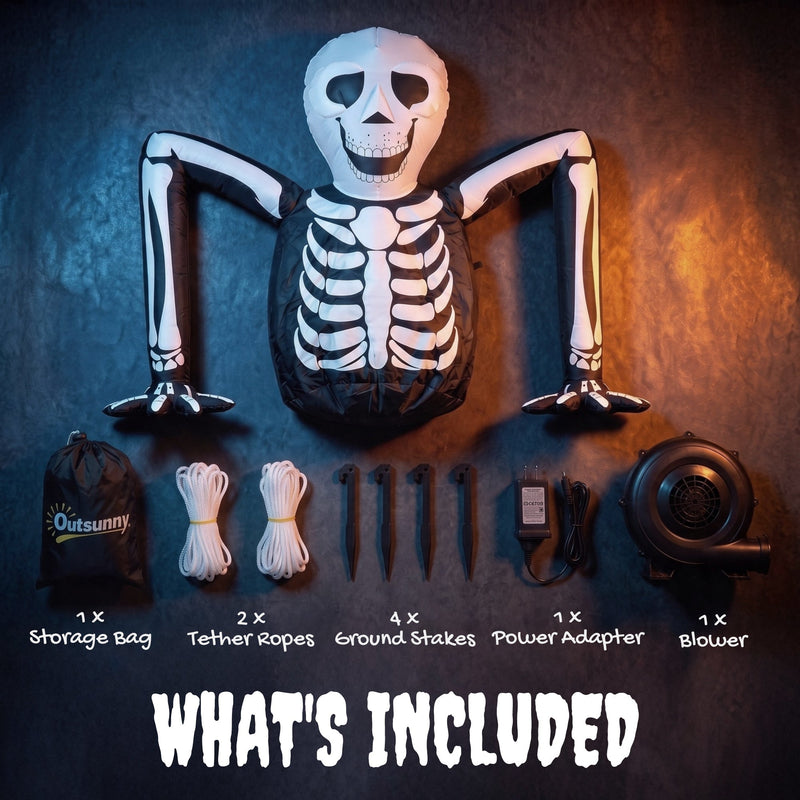 Flat-lay of the deflated skeleton with storage bag, tether ropes, ground stakes, blower and adapter