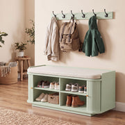 Light green hallway set styled with a backpack and jackets in a rustic-toned entryway
