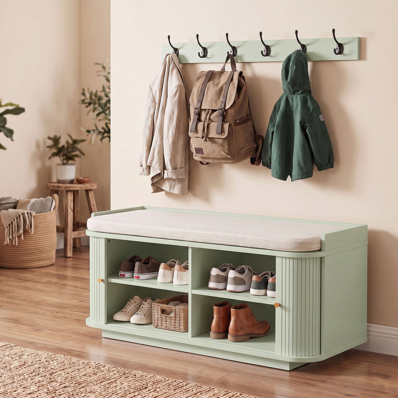 Light green hallway set styled with a backpack and jackets in a rustic-toned entryway
