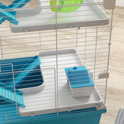 Close-up of the hut and food dish sitting on one of the cage's tiers