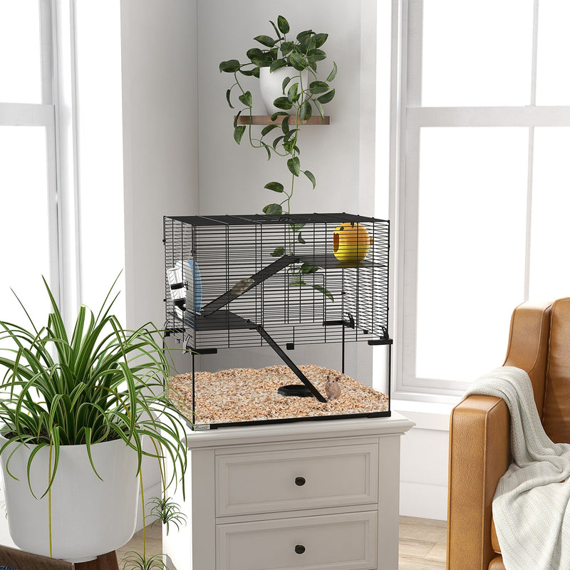 Hamster cage with glass base styled in a living room on a cabinet