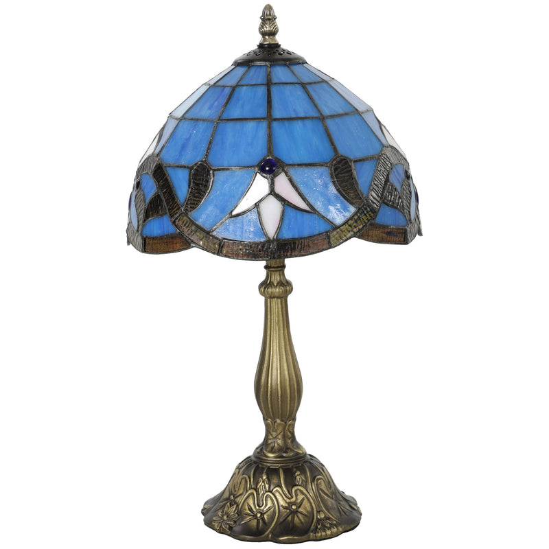 Stained glass table lamp with a fleur pattern shade on an ornate base, studio shot