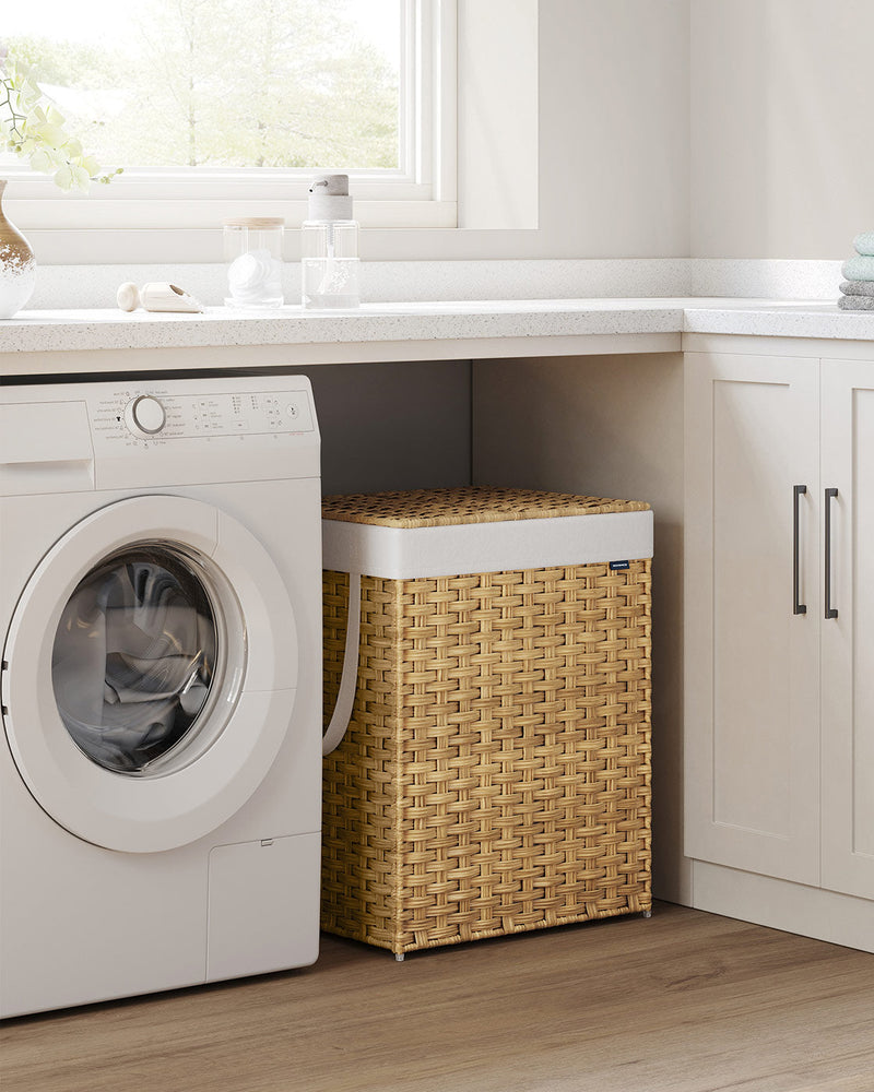 The rattan laundry basket with its lid closed, standing beside a washing machine in a utility room