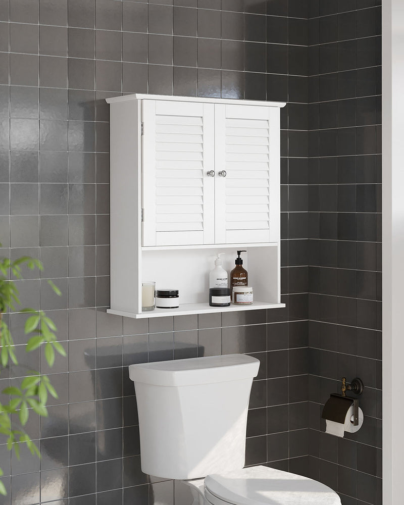 White bathroom wall cabinet mounted above a toilet on a dark tiled wall