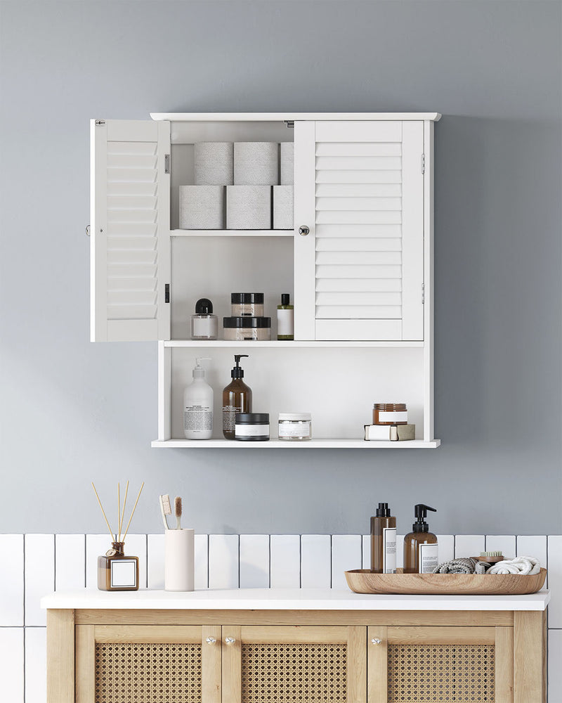 Wall cabinet with both doors open holding toilet rolls, jars and bottles