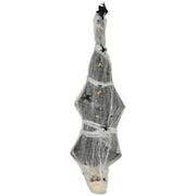 Hanging Halloween cocoon corpse wrapped in white webbing with fake spiders on a white background