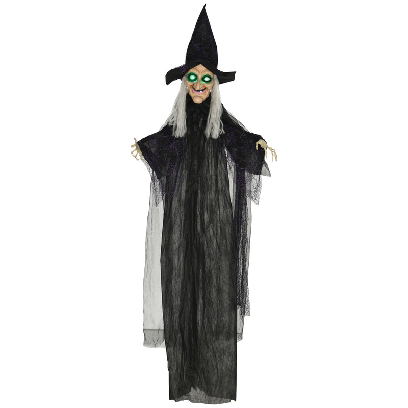 Hanging Halloween witch decoration in a black robe with green light-up eyes on a white background