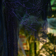 Close-up of the black webbed lace robe with purple glitter detail