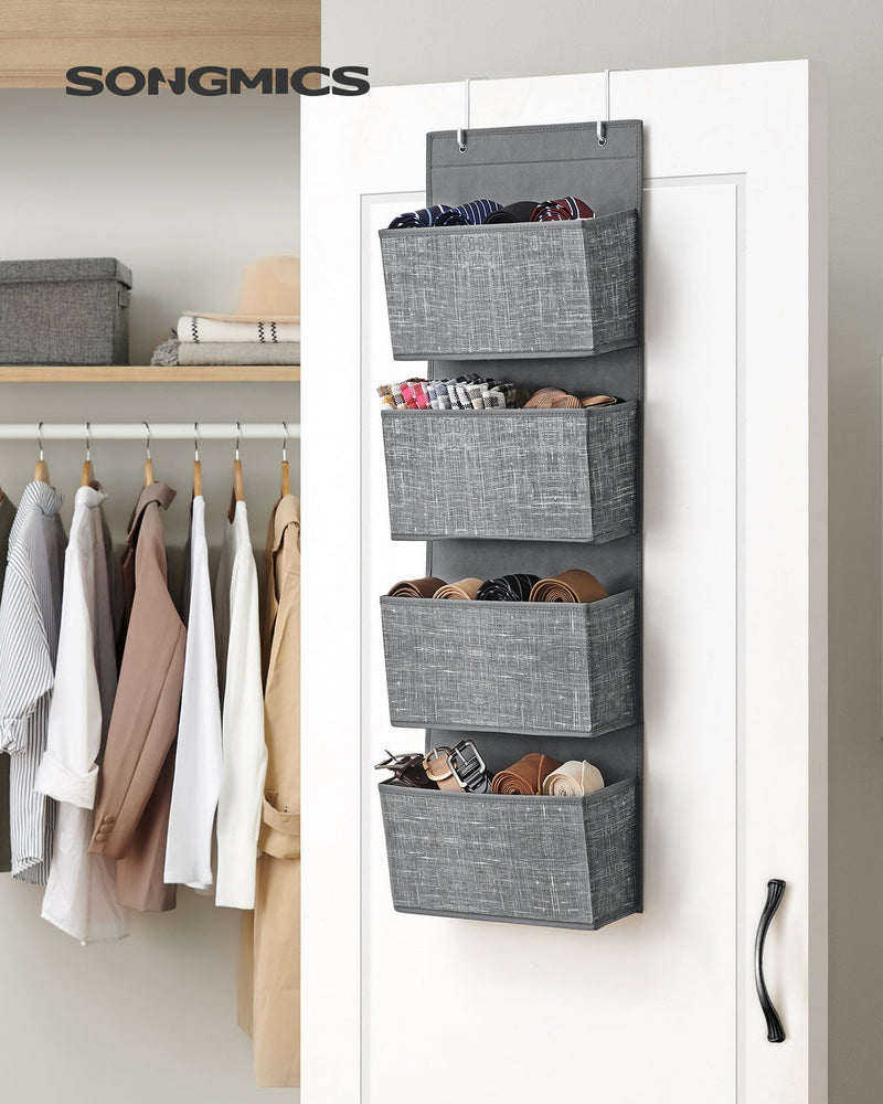 Grey hanging organiser on a wardrobe door holding ties and belts