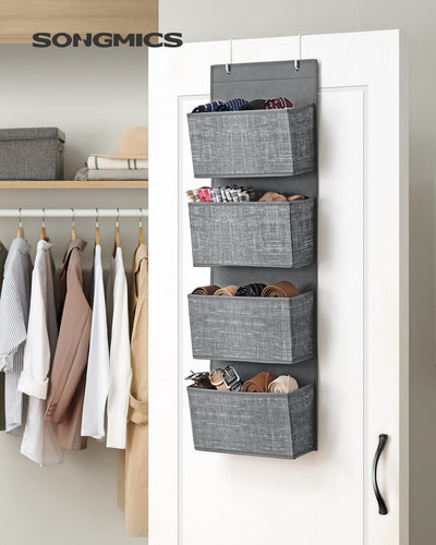Grey hanging organiser on a wardrobe door holding ties and belts