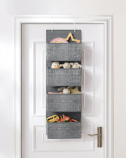 Hanging organiser on a kids bedroom door holding toys