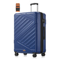Large 75 cm hard shell suitcase with double spinner wheels, handle raised and a luggage strap beside it