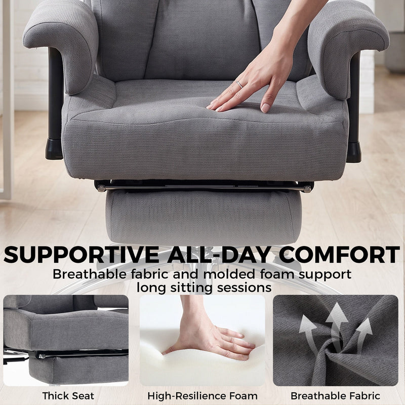 Hand pressing the thick padded seat of the grey office chair with foam and fabric detail panels