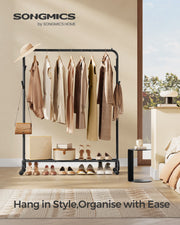 Close-up of the clothes rail's swivel castor wheels and base shelf