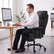 Man sitting upright in the Homcom office chair working at a desk computer