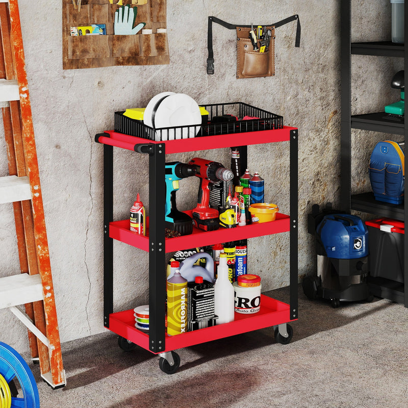 Tool trolley loaded with power tools and supplies against a garage wall beside a ladder