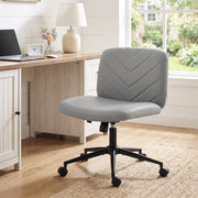 Grey desk chair in a home office beside a window