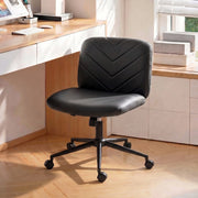 Black desk chair positioned at a home office desk