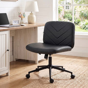 Black desk chair in a home office beside a window