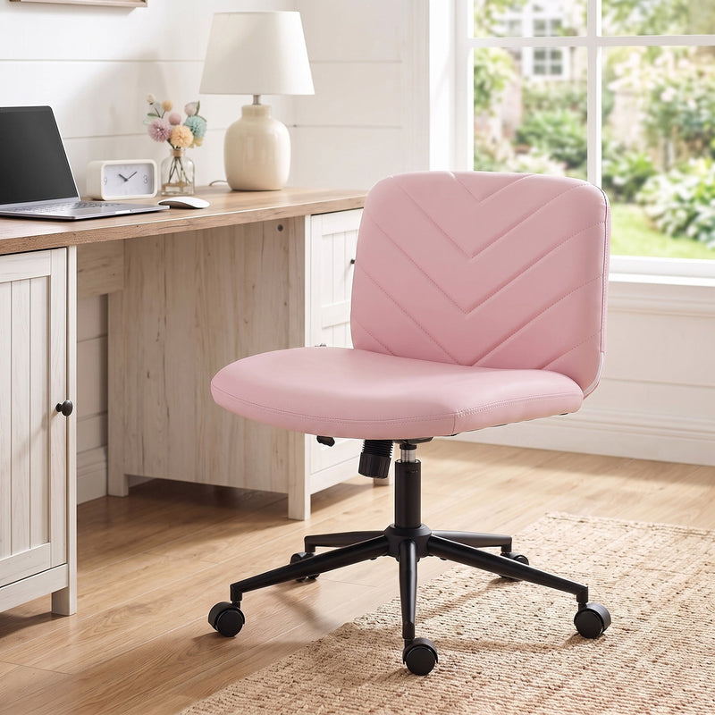 Pink desk chair beside a home office desk with a laptop