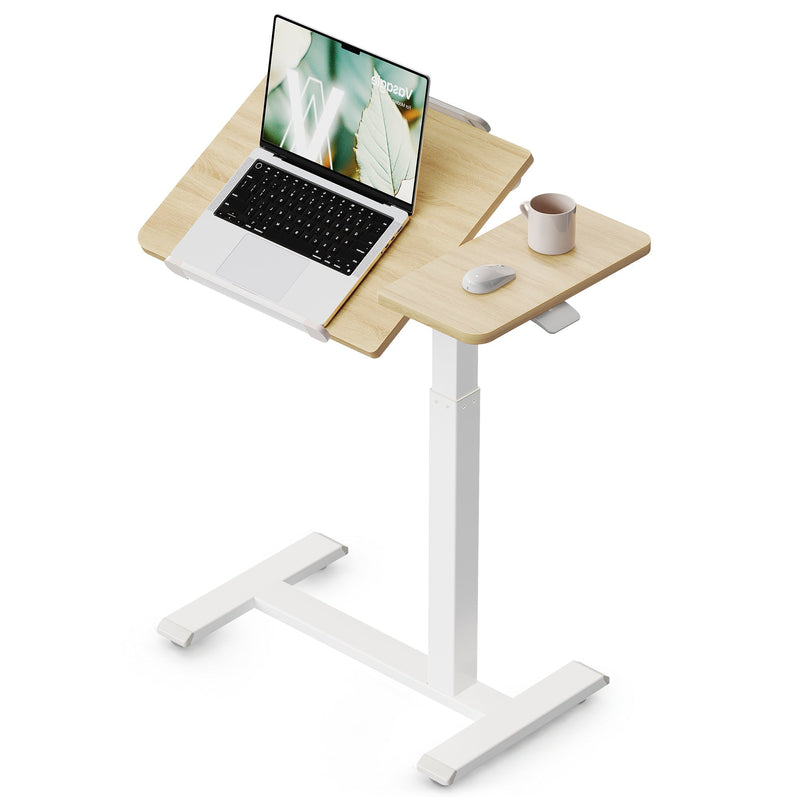 Golden Oak tilting overbed laptop table with a laptop on the angled panel and a mug on the side panel