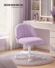 Purple teddy fleece swivel chair at a dressing table in a lilac bedroom
