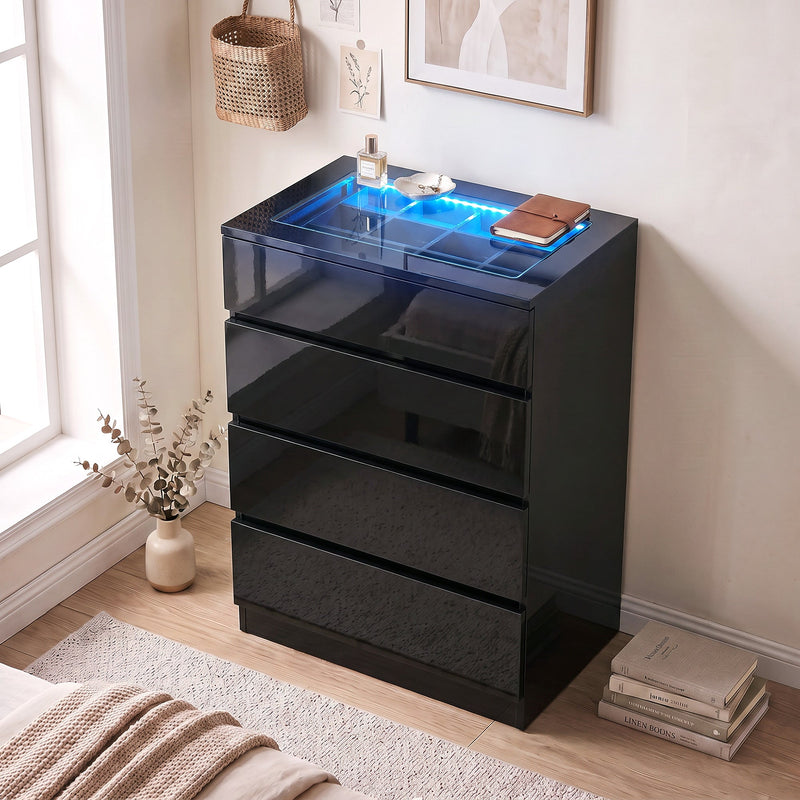 Black glossy chest of drawers with glowing top styled in a bright bedroom beside a window
