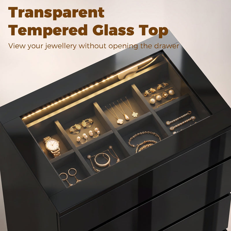 Close-up of the tempered glass top showing jewellery in the compartment tray with LED light