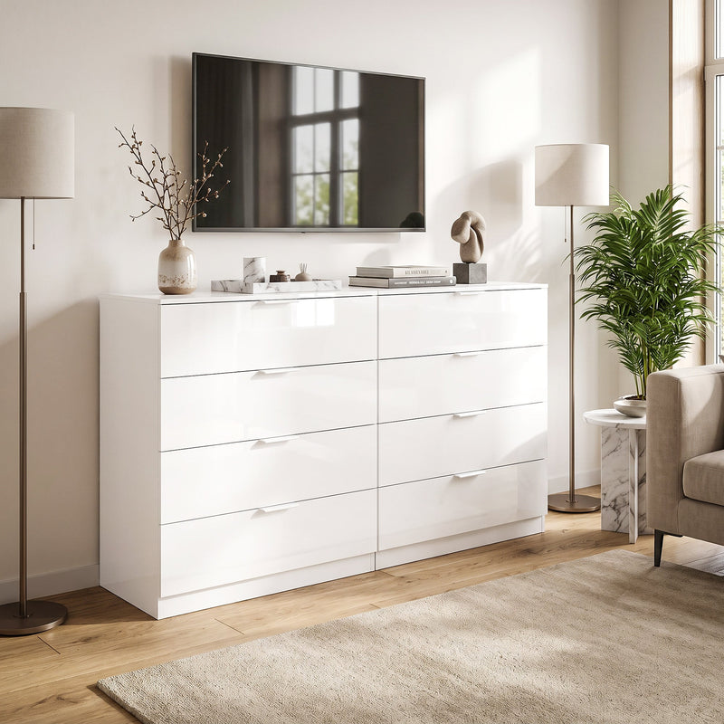 Two white high gloss chests of drawers paired together beneath a wall-mounted TV