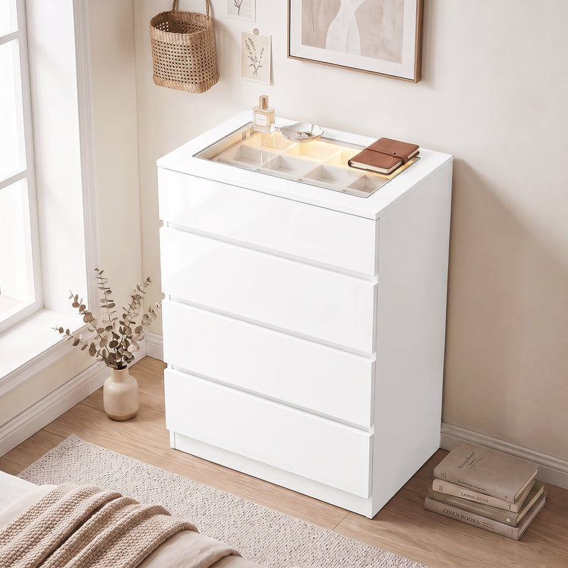 White gloss chest of drawers in a bedroom with the glass top jewellery tray open