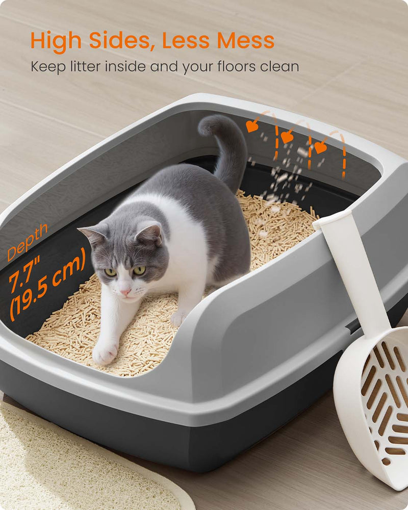 Cat inside the litter box showing the 19.5 cm high sides that contain litter scatter