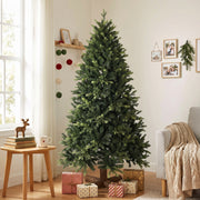 6ft tree in a living room beside a shelf with a reindeer ornament and small gifts