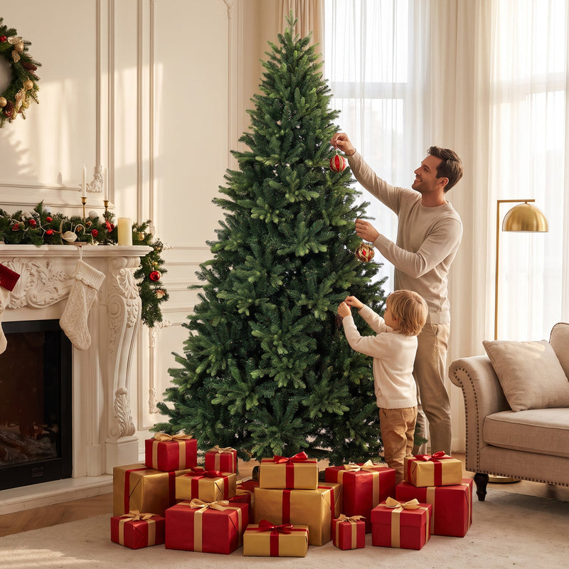Man and child hanging baubles on the 7ft tree above a pile of red gifts