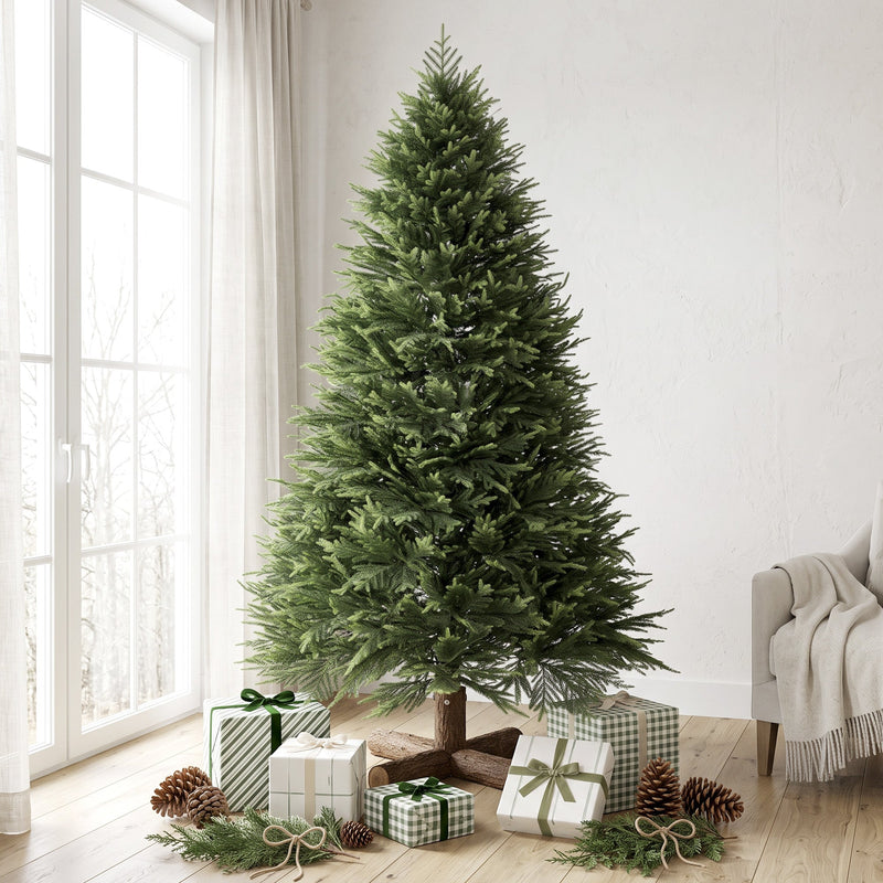 7ft artificial Christmas tree in a bright room with a window and wrapped gifts and pine cones