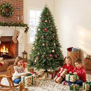 Decorated 7ft Christmas tree in front of a brick fireplace with children opening presents