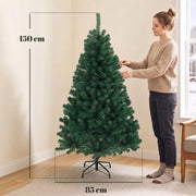 Dimensions of the 5ft Christmas tree: 150 cm high and 85 cm wide, with a woman shaping the branches