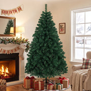 6ft green Christmas tree beside a fireplace with stockings and wrapped gifts under the branches