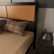 Close-up of the rustic brown wood-effect headboard panel grain