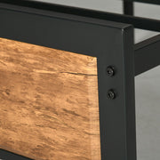 Close-up of the bed frame's corner joint and steel bolts