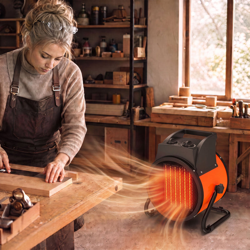 Woman working at a woodworking bench warmed by the industrial fan heater in a workshop