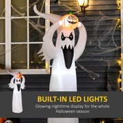 Ghost and its pumpkin lit from within against a cobwebbed window at night