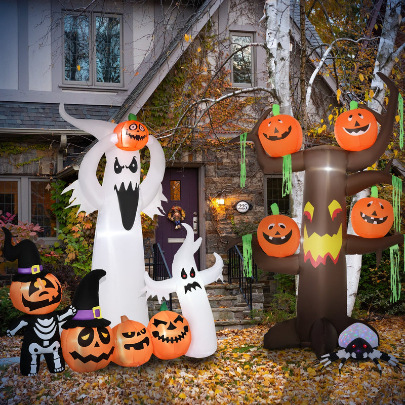 Ghost on autumn leaves outside a house with other Halloween inflatables