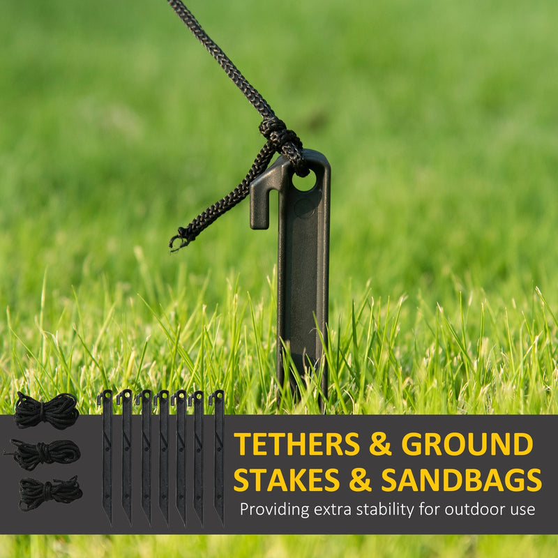 Ground stake in grass with spare stakes, tethers and sandbags below