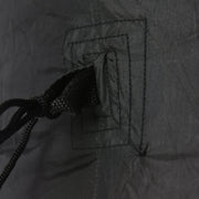 Close-up of a stitched anchor loop and tether cord on the black fabric