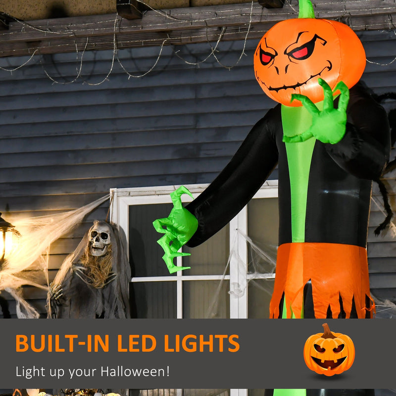 Close-up of the glowing pumpkin head and green hands at night