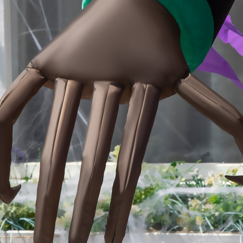 Close-up of the long inflatable clawed hand and purple sleeve