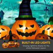 Large hatted pumpkin lit from within by its LED modules in a night garden